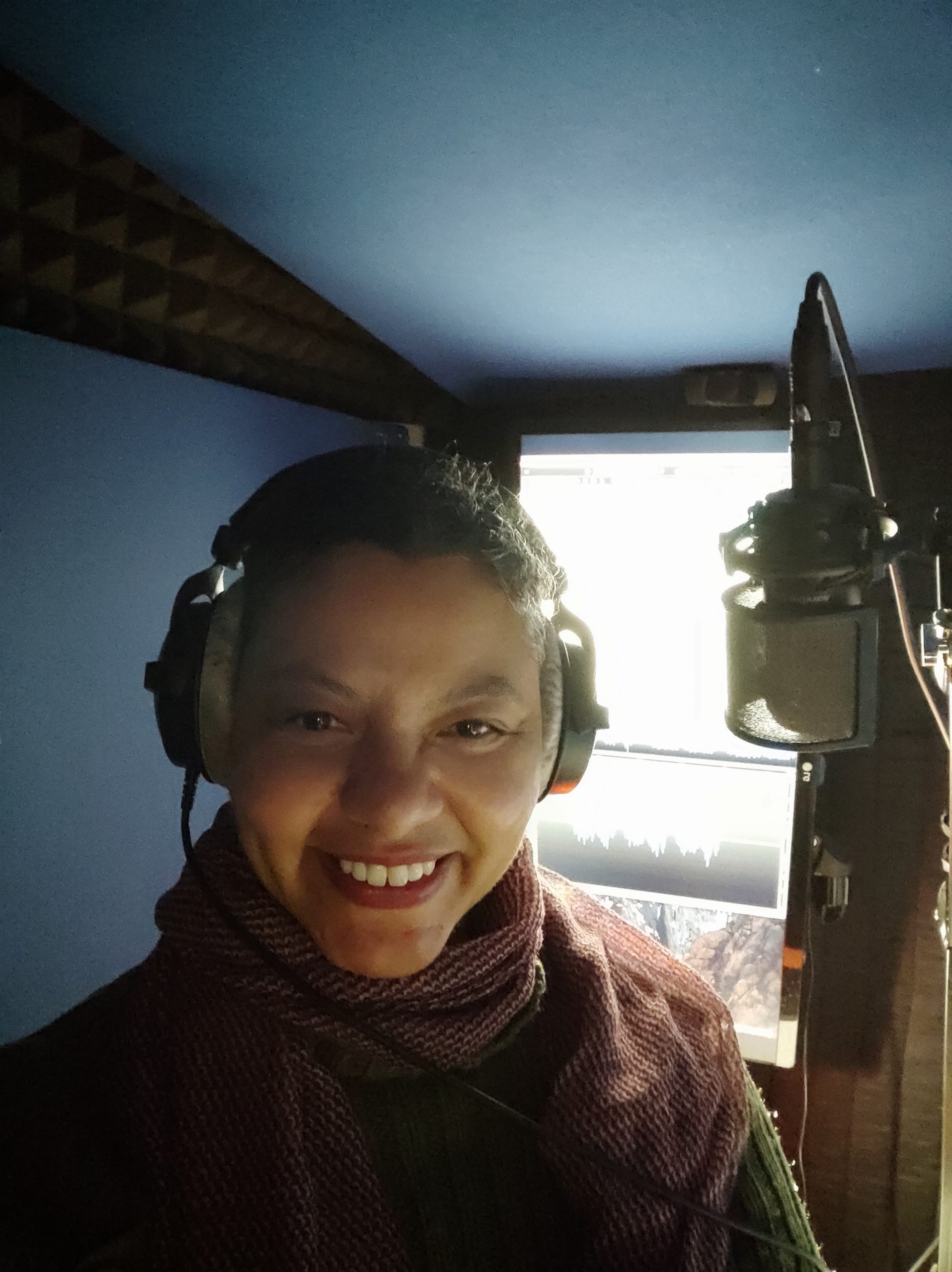 Voice actor Sion Dayson in her booth.